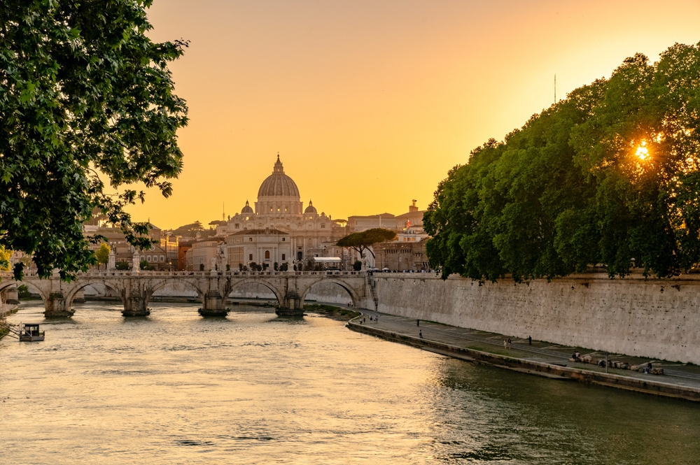 Sunset,Over,The,Tiber,River,With,St.,Peter's,Basilica,In