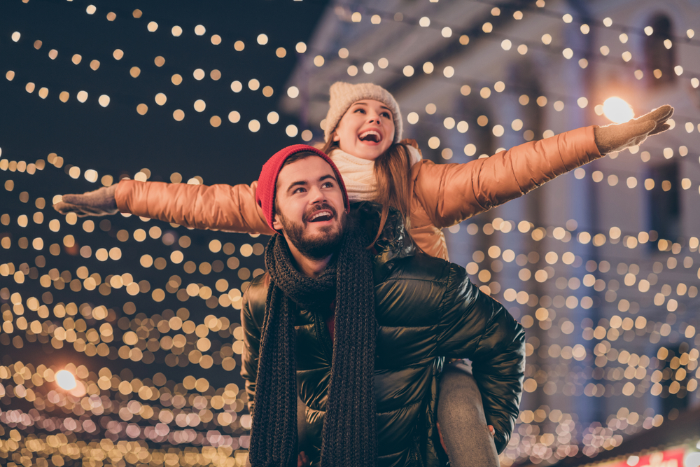 Photo,Of,Positive,Couple,Having,Fun,Christmas,X mas,Around,Evening