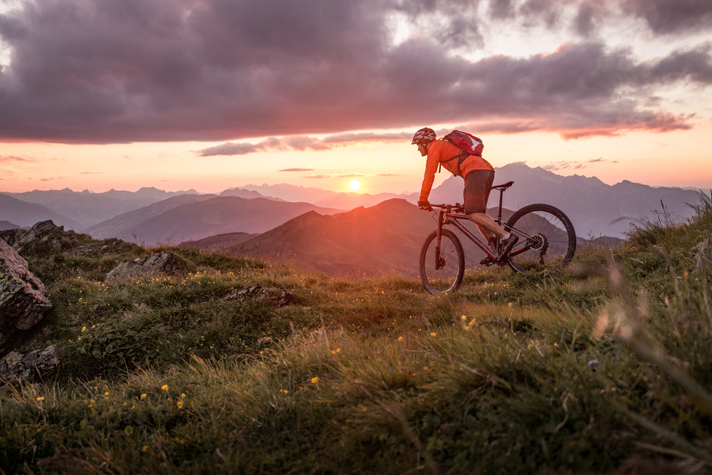 Male,Mountainbiker,At,Sunset,In,The,Mountains