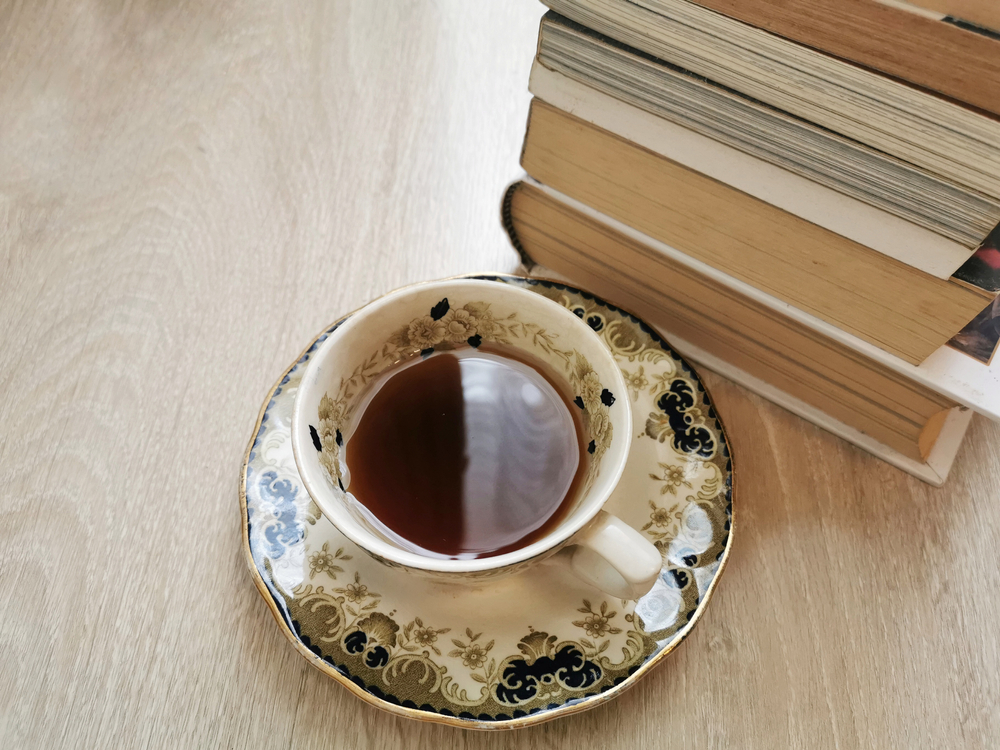 Stack,Of,Hardback,Books,And,A,Cup,Of,Tea,In