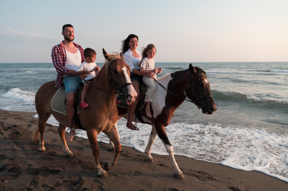 The,Family,Spends,Time,With,Their,Children,While,Riding,Horses